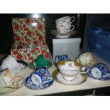 A good lot of cups and saucers including a boxed pair of Royal Worcester cups and saucers