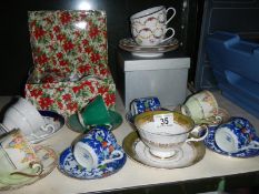 A good lot of cups and saucers including a boxed pair of Royal Worcester cups and saucers