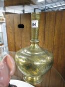 A Persian brass bottle vase