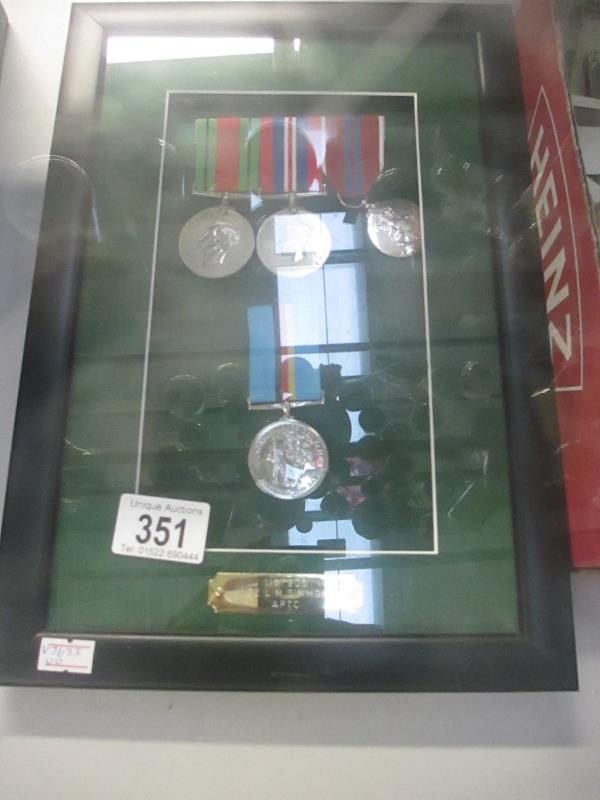 A framed set of 4 medals awarded to 1157905W02 L.M.