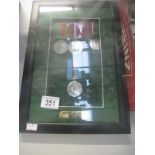 A framed set of 4 medals awarded to 1157905W02 L.M.
