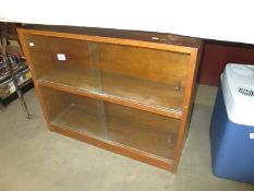 A 1950's dark wood stained bookcase