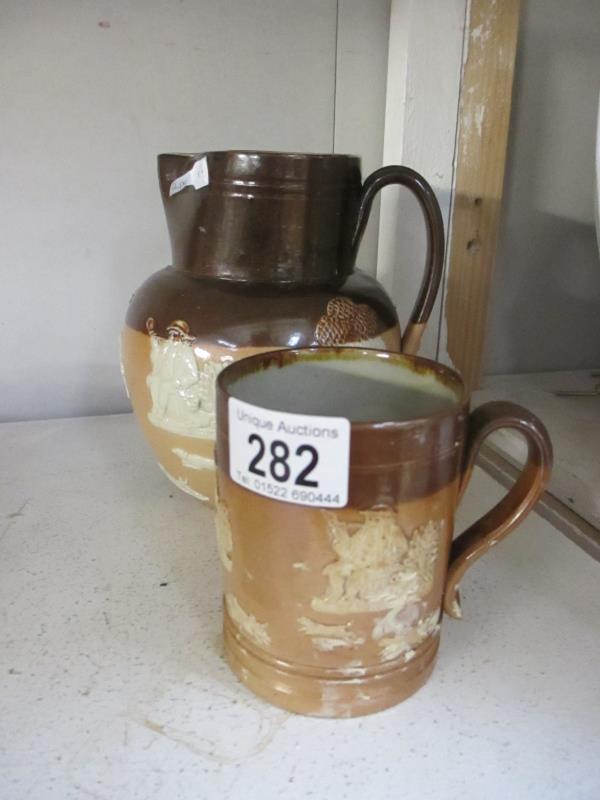 A Doulton stoneware jug and tankard