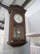 A 1930's oak wall clock