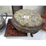 A Victorian tapestry covered footstool and a teapot stand