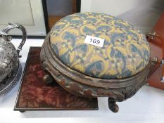 A Victorian tapestry covered footstool and a teapot stand