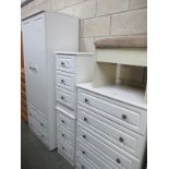 A 4 piece white finished bedroom chest of drawers and wardrobe