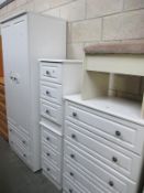 A 4 piece white finished bedroom chest of drawers and wardrobe