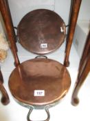 A pair of large Victorian copper pan lids