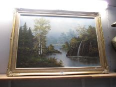 A large gilt framed oil on canvas of wooded water scene,