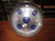 A large decorative Chinese cabinet plate