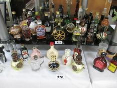 A quantity of miniature bottles including rum, whisky, liqueur, brandy etc.