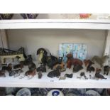 A shelf full of dachshund figures etc.