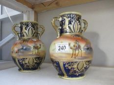 A pair of Noritake desert scene vases