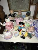 A collection of teapots and money boxes