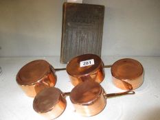 5 miniature copper saucepans and a Mrs.