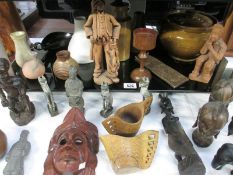 A quantity of pottery and African wooden items