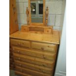 A solid pine 6 drawer chest of drawers and dressing table mirror