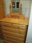 A solid pine 6 drawer chest of drawers and dressing table mirror