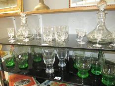 2 cut glass decanters with various sets of glasses