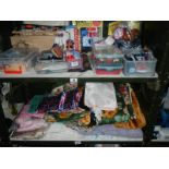 2 shelves of sewing related items and fabric