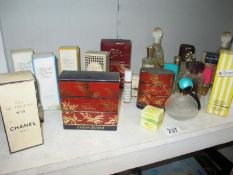 A shelf of perfume including some vintage, Chanel No.19, Opium, etc.