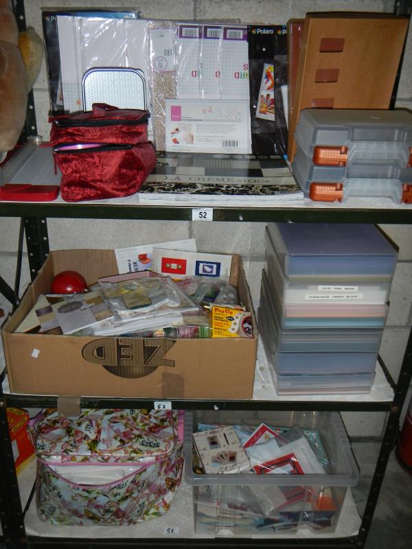 3 shelves of craft work items including a large amount of crafting paper