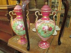 A large pair of lidded vases/urns