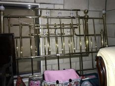 A 5ft brass effect bed frame