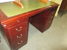 A dark wood stained office double pedestal desk with leather insert