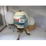 3 Ostrich eggs, 2 on stands, 1 decorated with Cape Town,