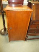 A 1930's oak cupboard