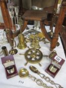 A quantity of brassware including candlesticks and cutlery