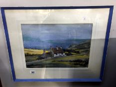 A framed and glazed watercolour of a house by the sea signed Bereford Johnson