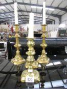 A pair of Victorian brass candlesticks and 2 others