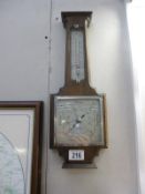 A 1930's oak aneroid barometer