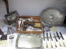 A large quantity of cutlery, trays etc.