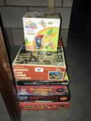 A quantity of jigsaws/games