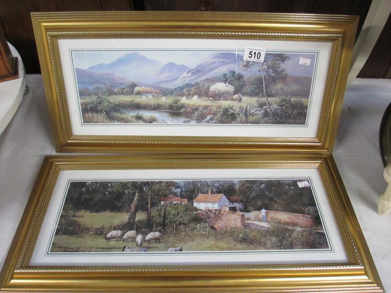 A pair of gilt framed bygone farming scenes