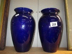 2 blue pottery vases