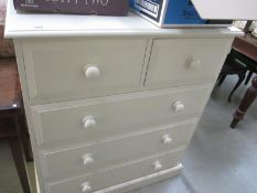 A solid pine painted chest of drawers