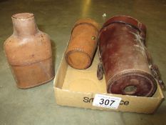 A leather cased set of 6 beakers,