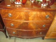 A Victorian mahogany bow front chest of drawers with banded inlay top