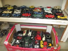 2 shelves of diecast cars on stands