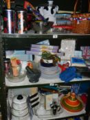 3 shelves of kitchenalia including saucepans, wicker basket, crockpot etc.