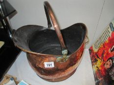 An Edwardian copper coal scuttle