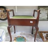 An Edwardian mahogany piano stool