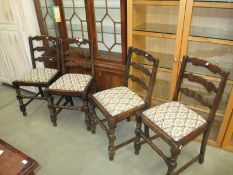 A set of four cottage dining chairs