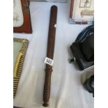 A wooden truncheon