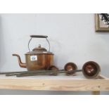An old copper kettle and 3 copper graduated measures